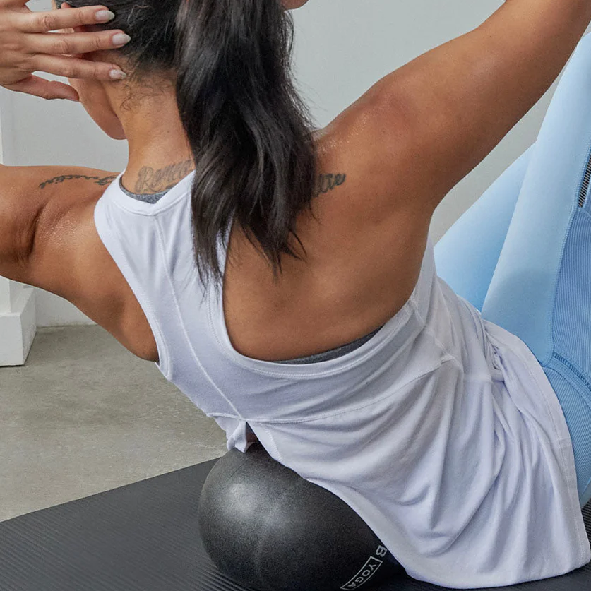 b, halfmoon Stability Ball woman using under back